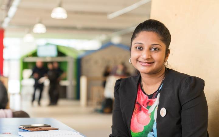 Indian student sitting in the SU